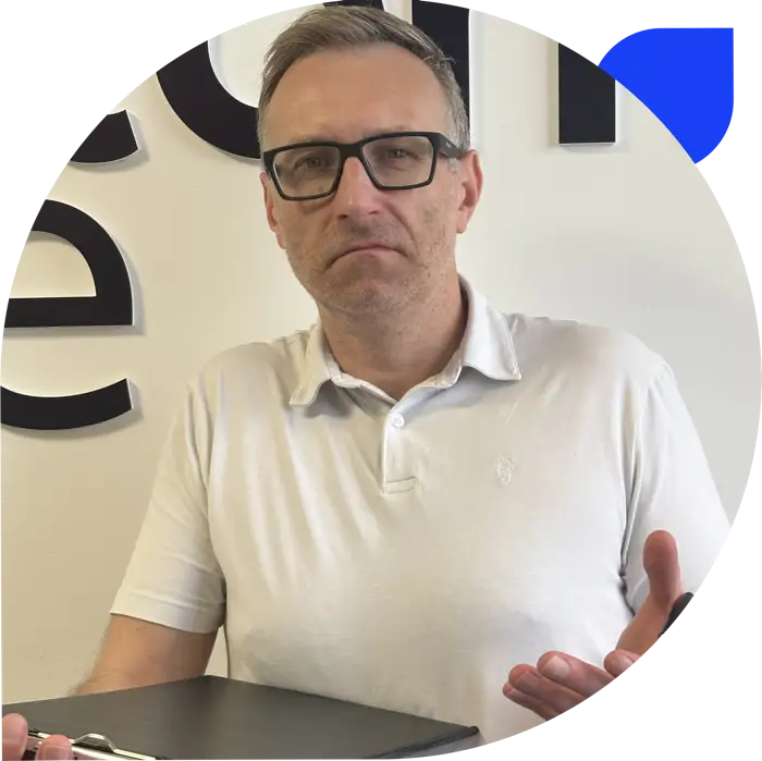 Darren looking dubious with a clipboard.